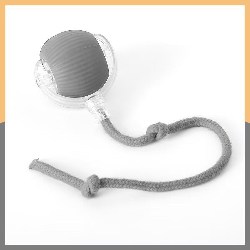 Gray silicone cat ball toy with a rope on a white background
