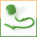 Green silicone ball with a rope on a white background